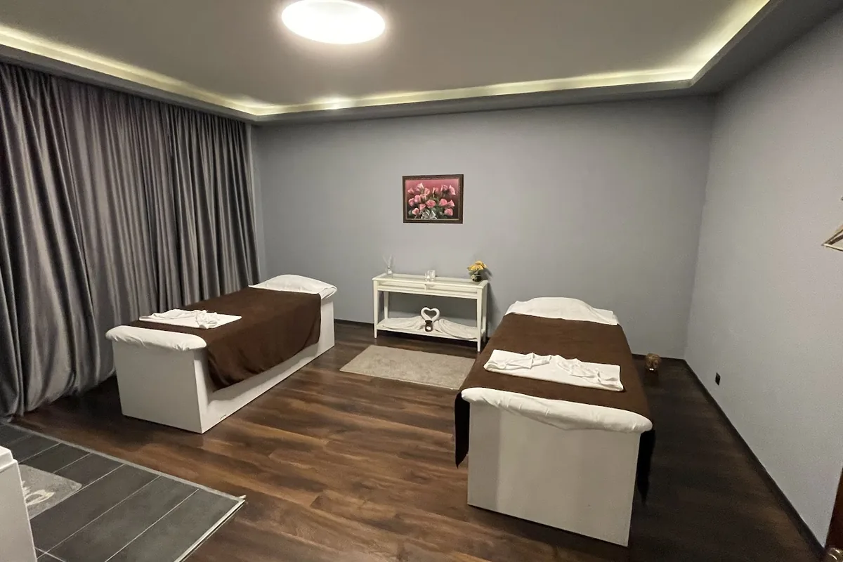 Treatment room with two massage beds at Aroma Thai Massage