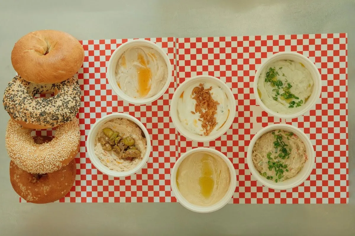 Bagels with bowls of house spreads at Bar Bagel in Fabrika