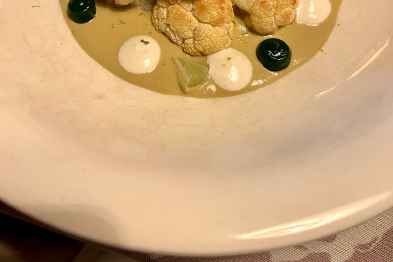 Roasted cauliflower florets with puree and sauces at Barbarestan