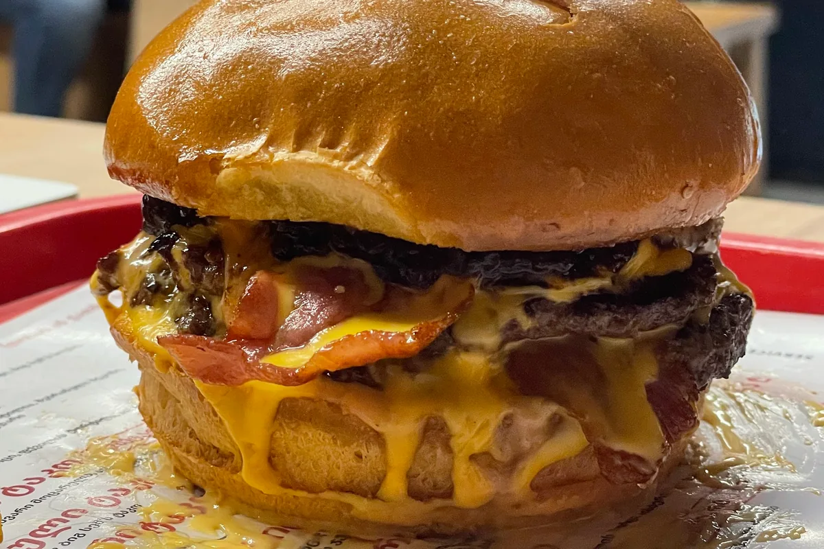 Double bacon cheeseburger on a brioche bun at Big Sam’s Galleria Tbilisi