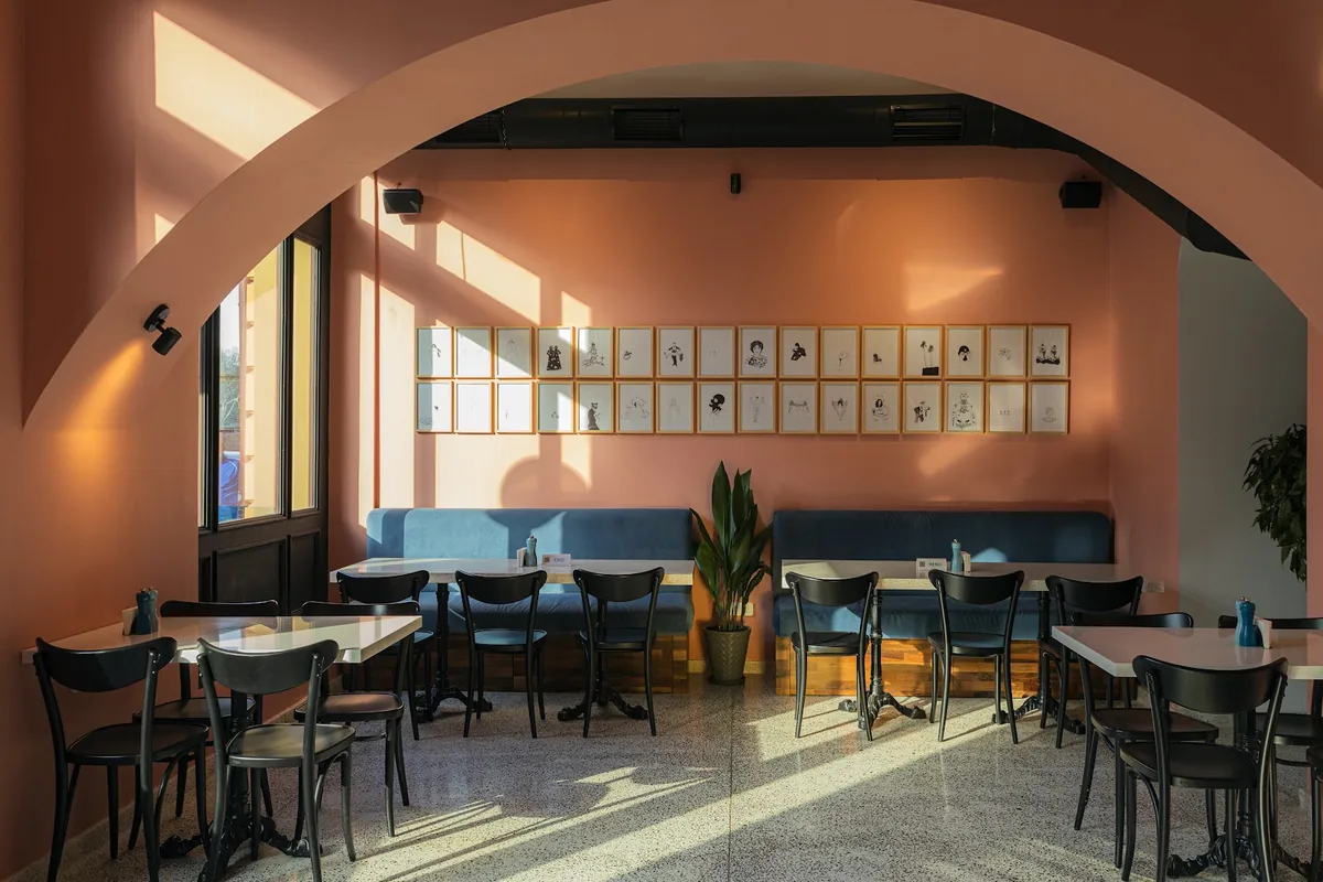 Arched dining room with peach walls at Cafe Daphna on Atoneli Street, by the Dry Bridge in Tbilisi