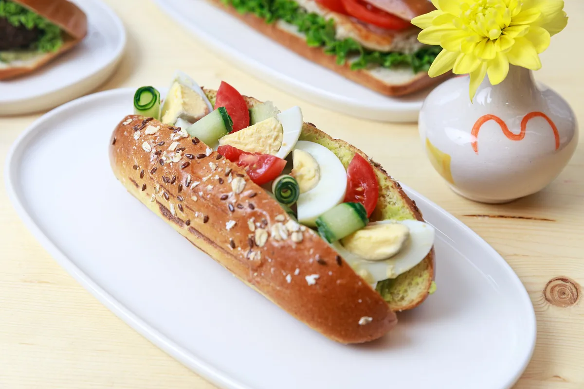Egg and cucumber sandwich on an oval plate at Cafe Mziuri
