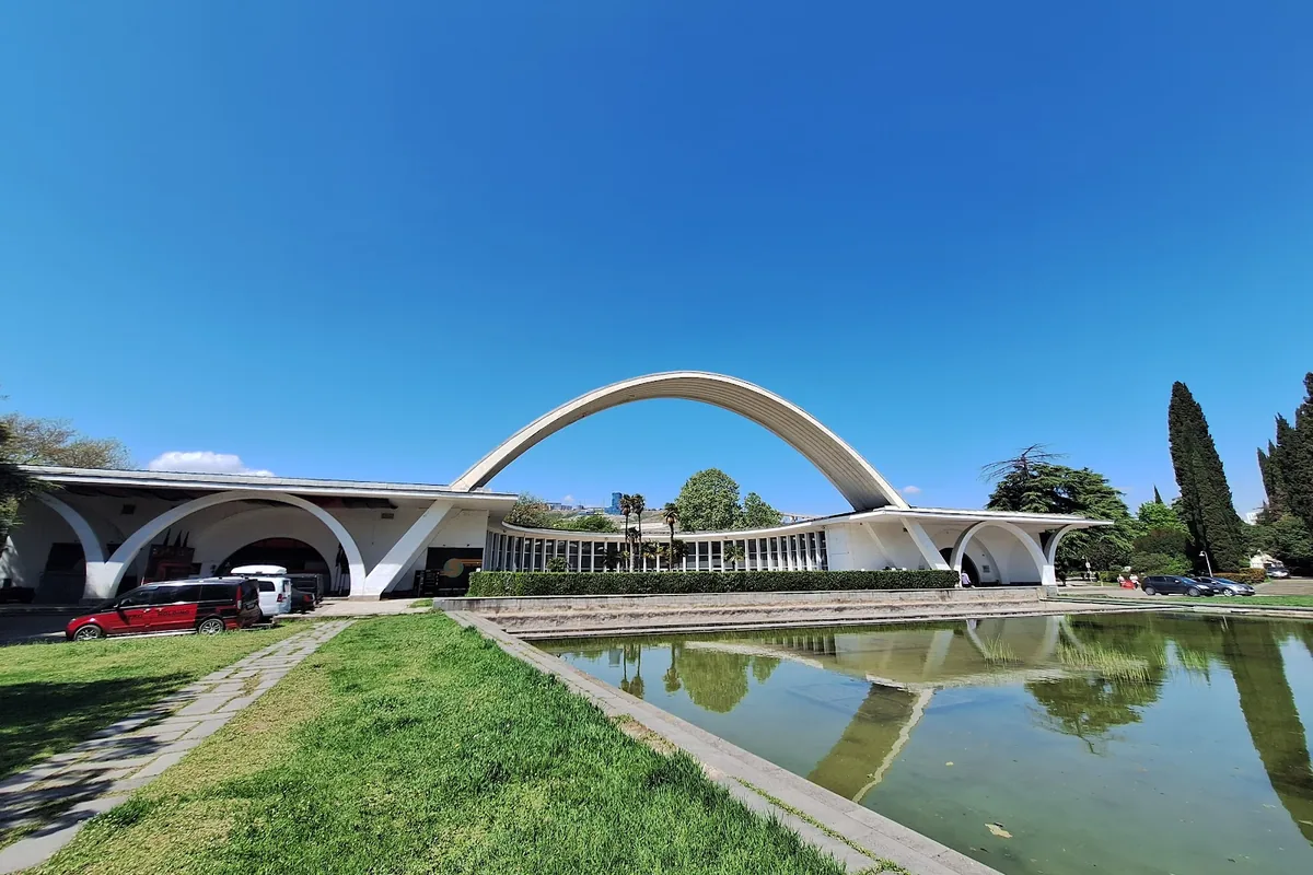 The white concrete arch over the main pavilion and reflecting pool at the ExpoGeorgia exhibition center