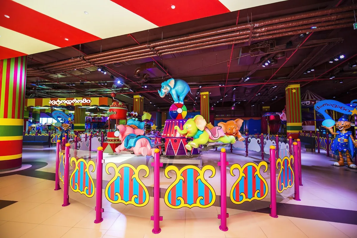 An elephant carousel on the circus-themed arcade floor at Focus Mokus