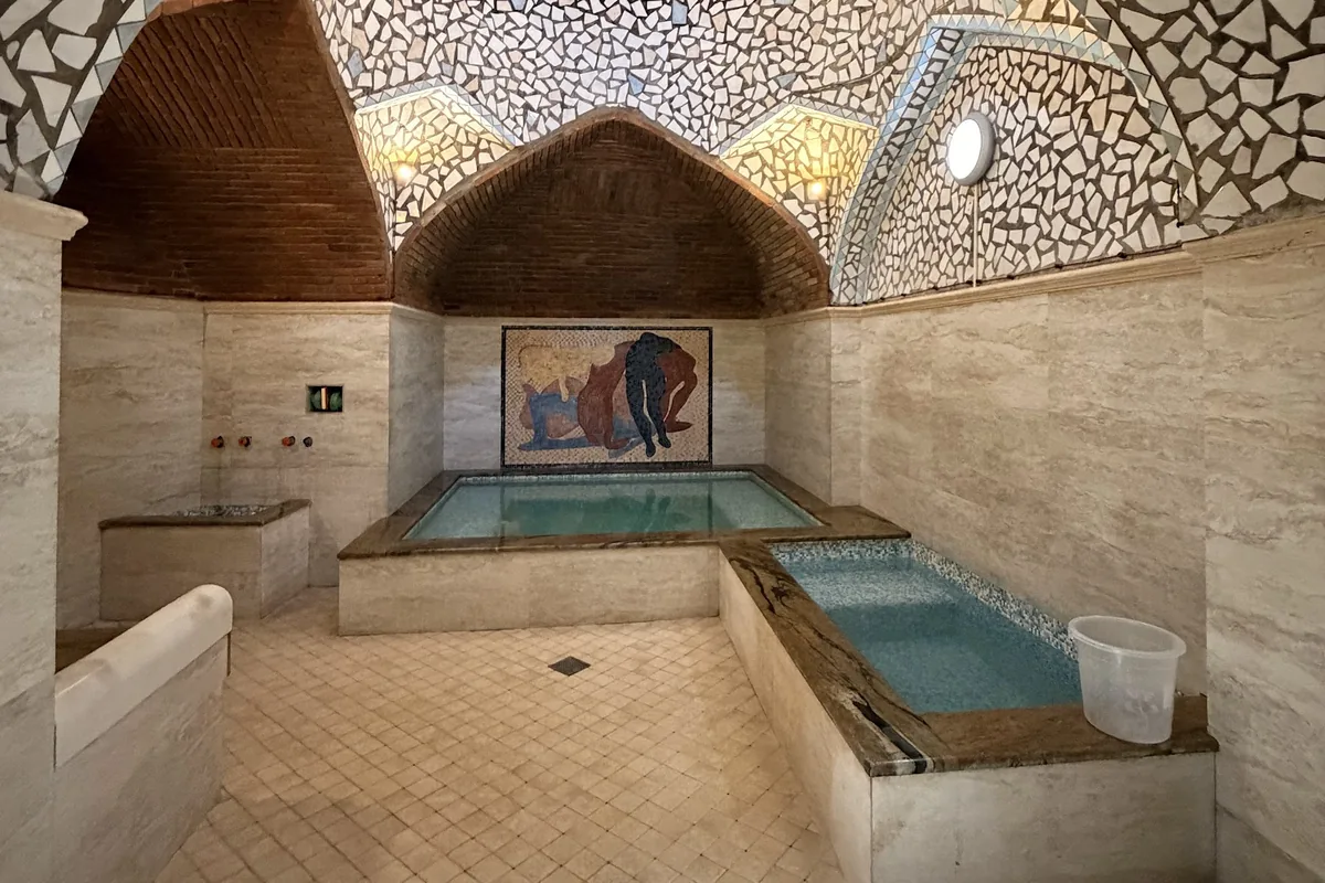 Private sulfur pool under a mosaic dome at Gulo's Thermal Spa