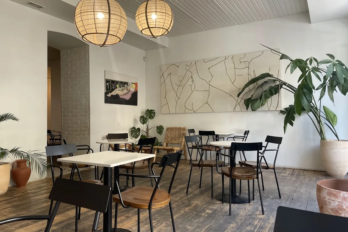 Dining room with rattan lamps at Hello Breakfast