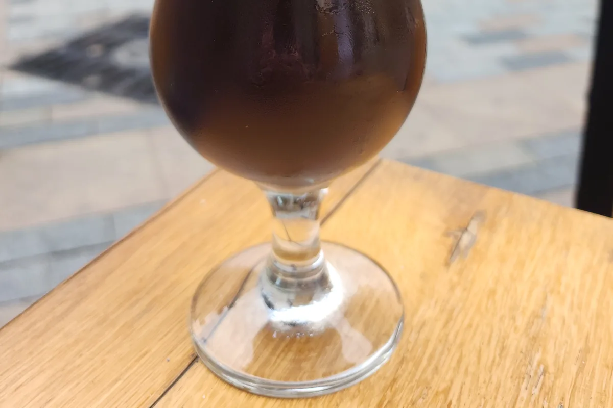 Dark beer in a footed glass at HOPA Taproom