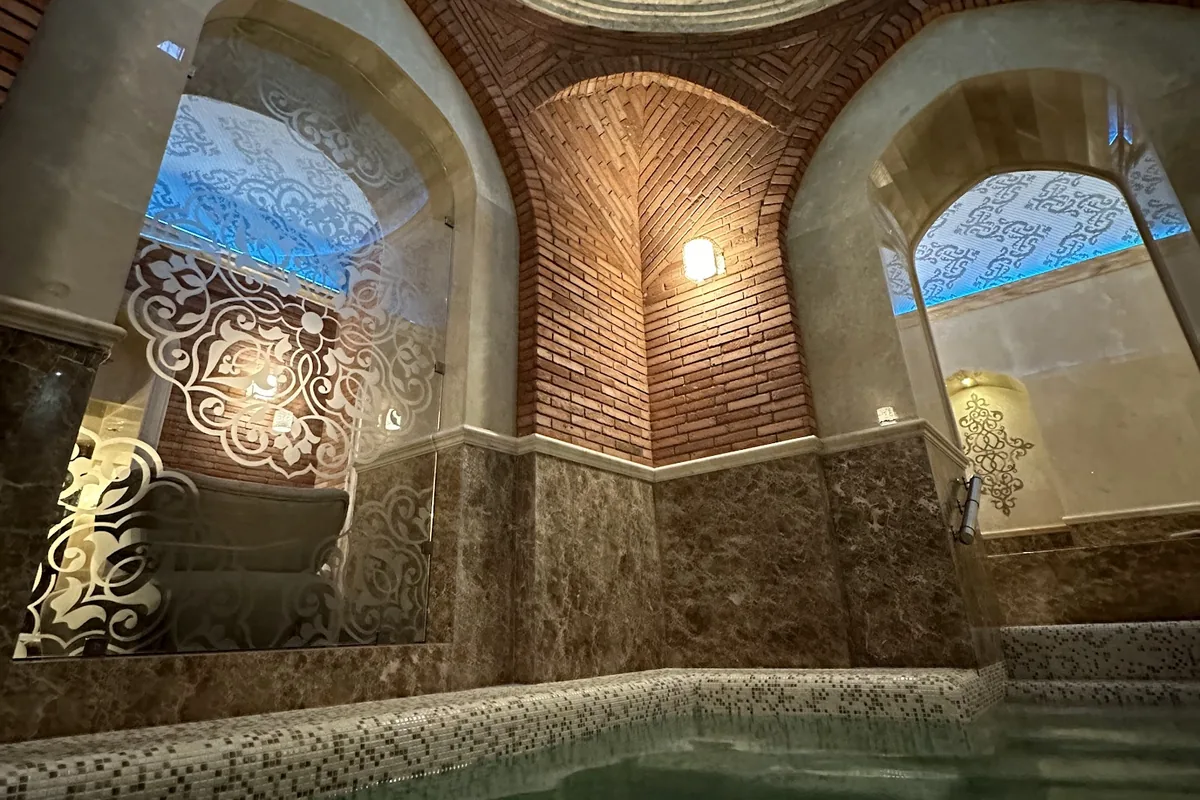 Sulfur pool under a blue mosaic dome at King Erekle's Bath