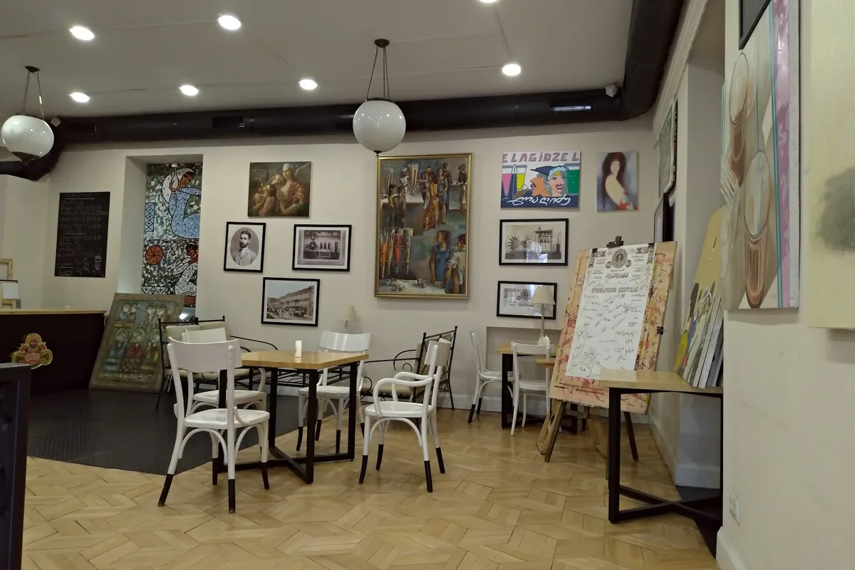 Cafe room with framed pictures at Lagidze Water on Paliashvili Street
