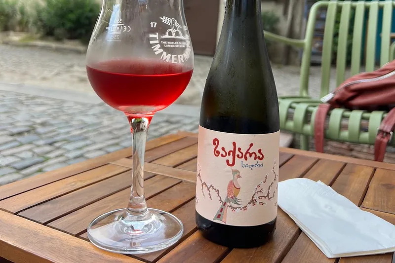 Bottle of Georgian cider and a glass of red cider at Lutra Lutra Bar