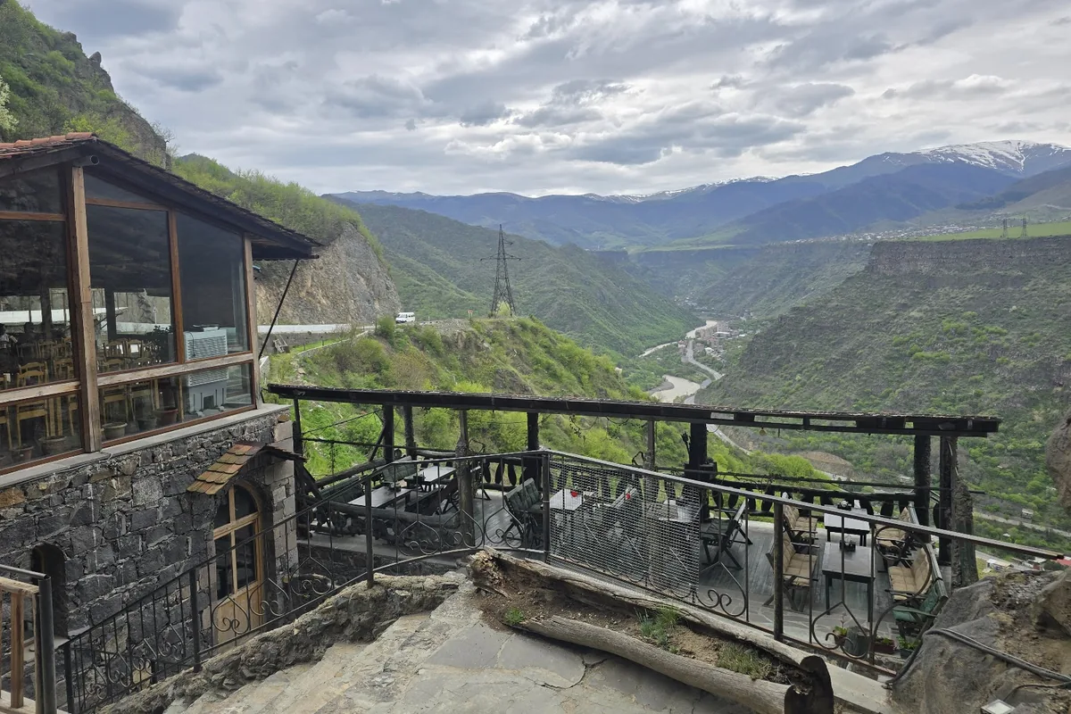 The glass-fronted dining room and terrace of Mendz Er perched above the Debed canyon near Alaverdi