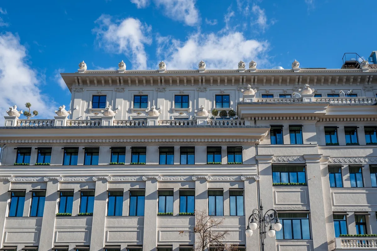 Monograph Freedom Square's white facade above Pushkin Street