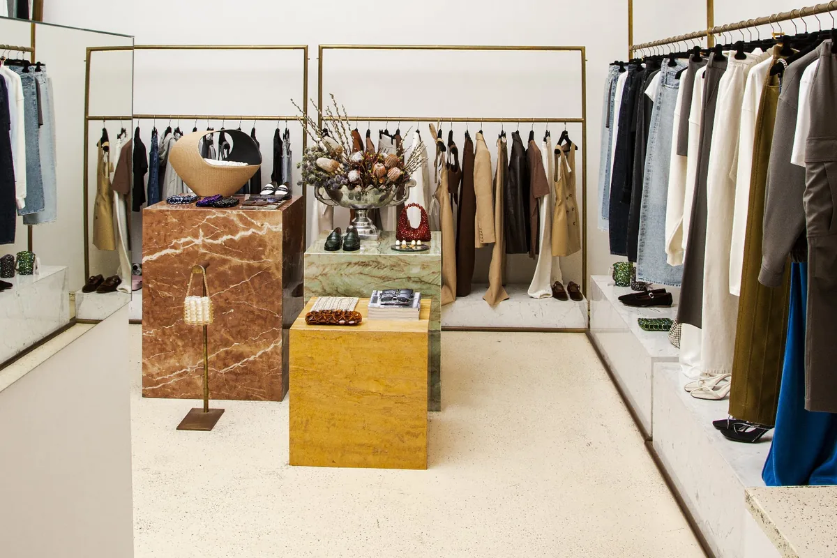 Clothing rails and marble display plinths inside the MORE is LOVE boutique on Leo Kiacheli Street