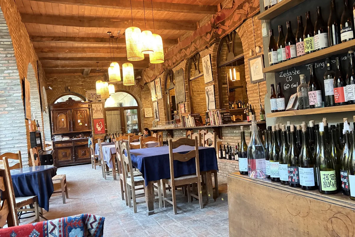 Dining room with wine shelves at Pheasant's Tears in Sighnaghi