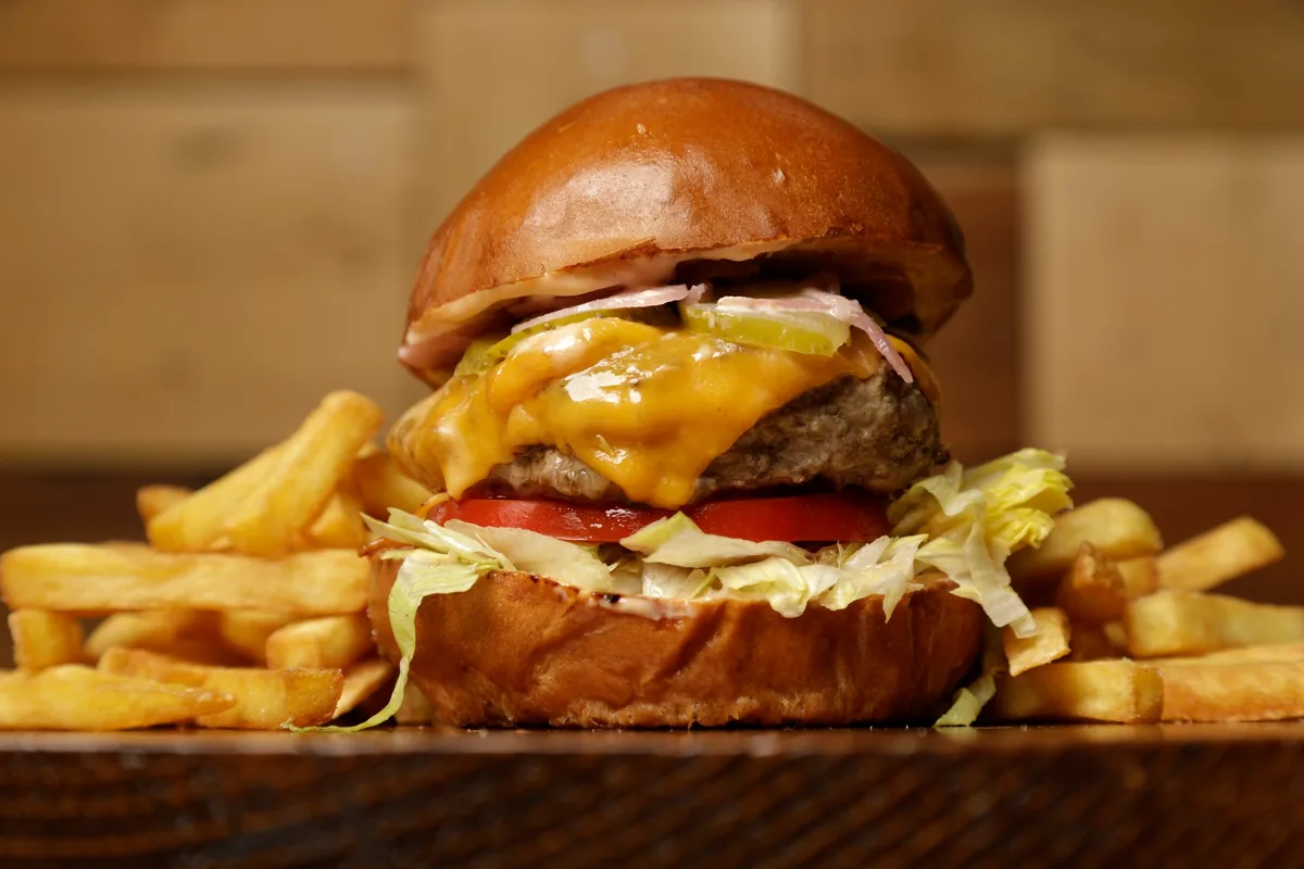 Cheeseburger with french fries at PIPES Burger Joint