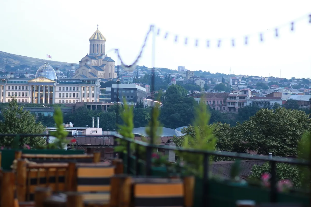 Terrace tables with a view over the Old Town at Point Terrasse
