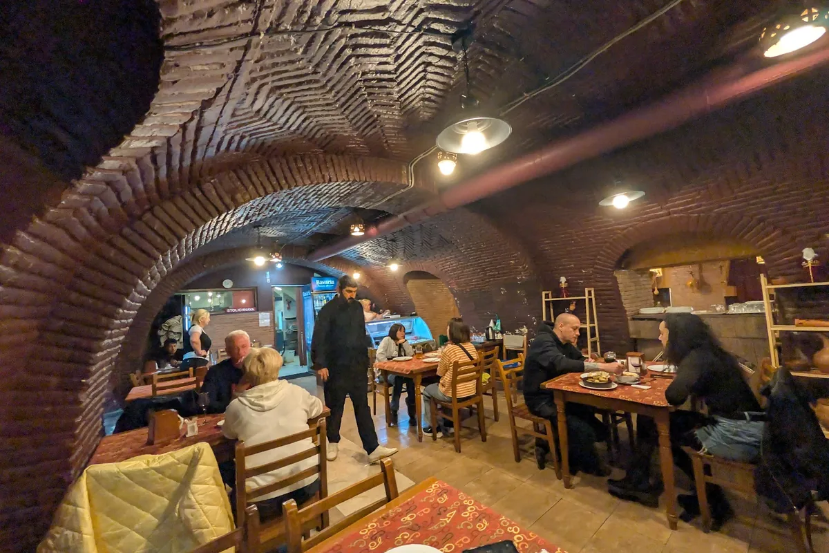 Vaulted brick cellar dining room at Racha
