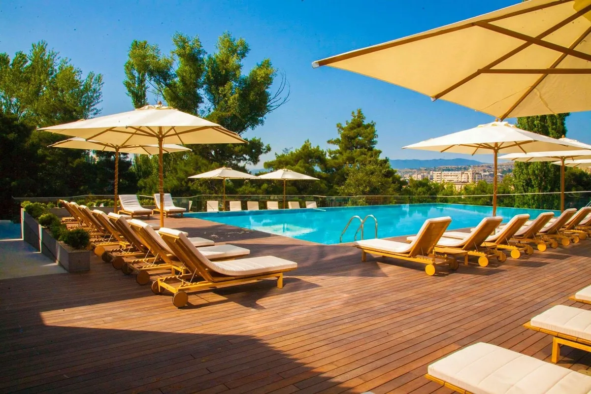 Outdoor pool and sun loungers at the Radisson Blu Iveria