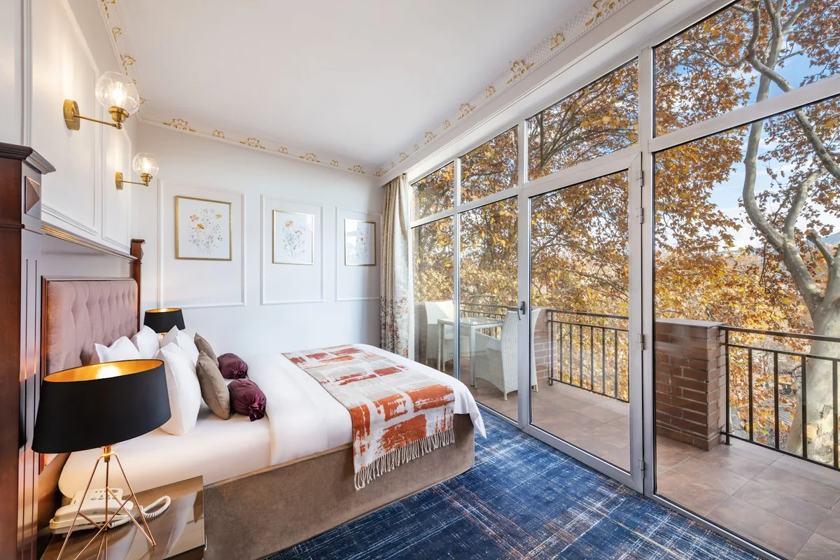 Guest room with a balcony at River Side Hotel