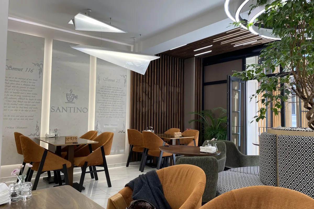 Orange velvet chairs, paper-plane lamps and Shakespeare sonnets on the wall at Santino on Atoneli Street