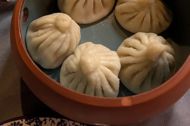 Khinkali in a steamer bowl at Sheen Aura