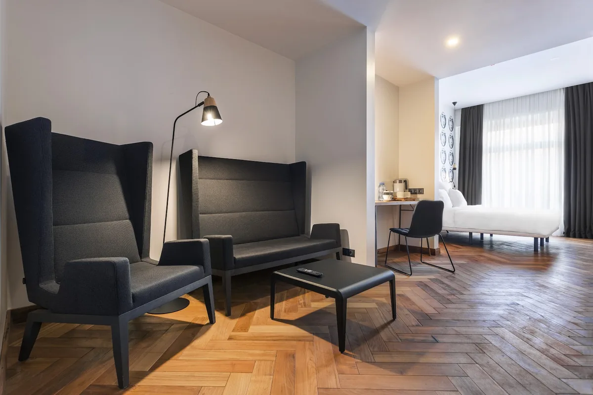 Guest room with herringbone floors at Shota @ Rustaveli