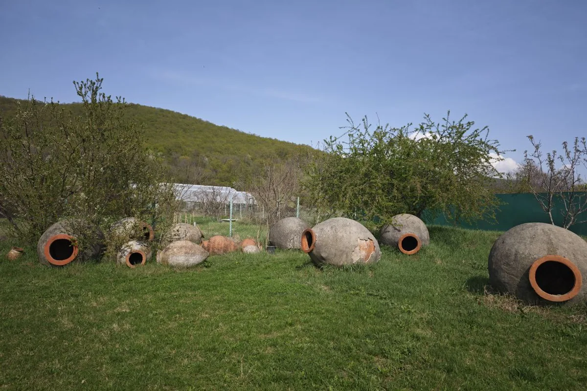 Qvevri on the lawn at TEMI Community near Gremi