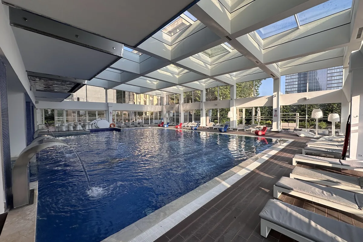 Indoor pool under a glass roof at The Biltmore Tbilisi