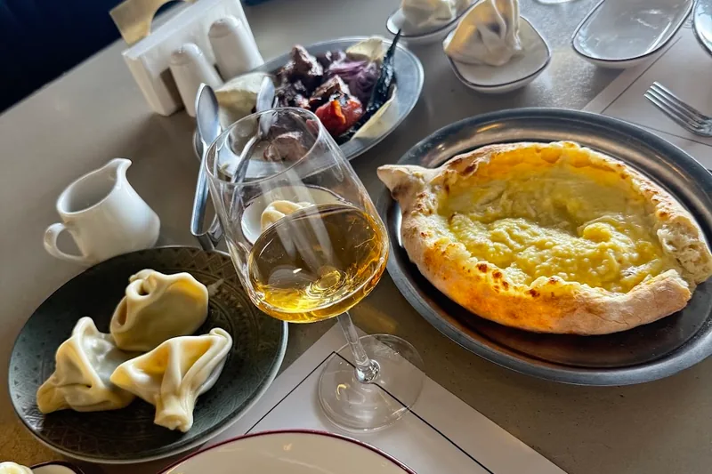 Khachapuri and khinkali spread with white wine at Tsiskvili Terrace