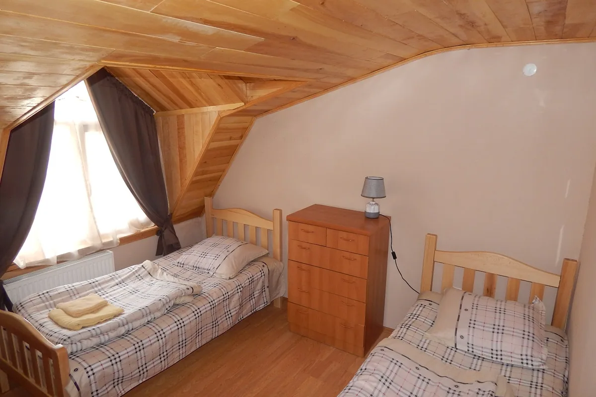Attic twin room with a wooden ceiling at When in Tbilisi guesthouse