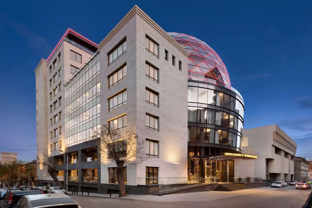 Wyndham Grand Tbilisi with its glass dome at dusk