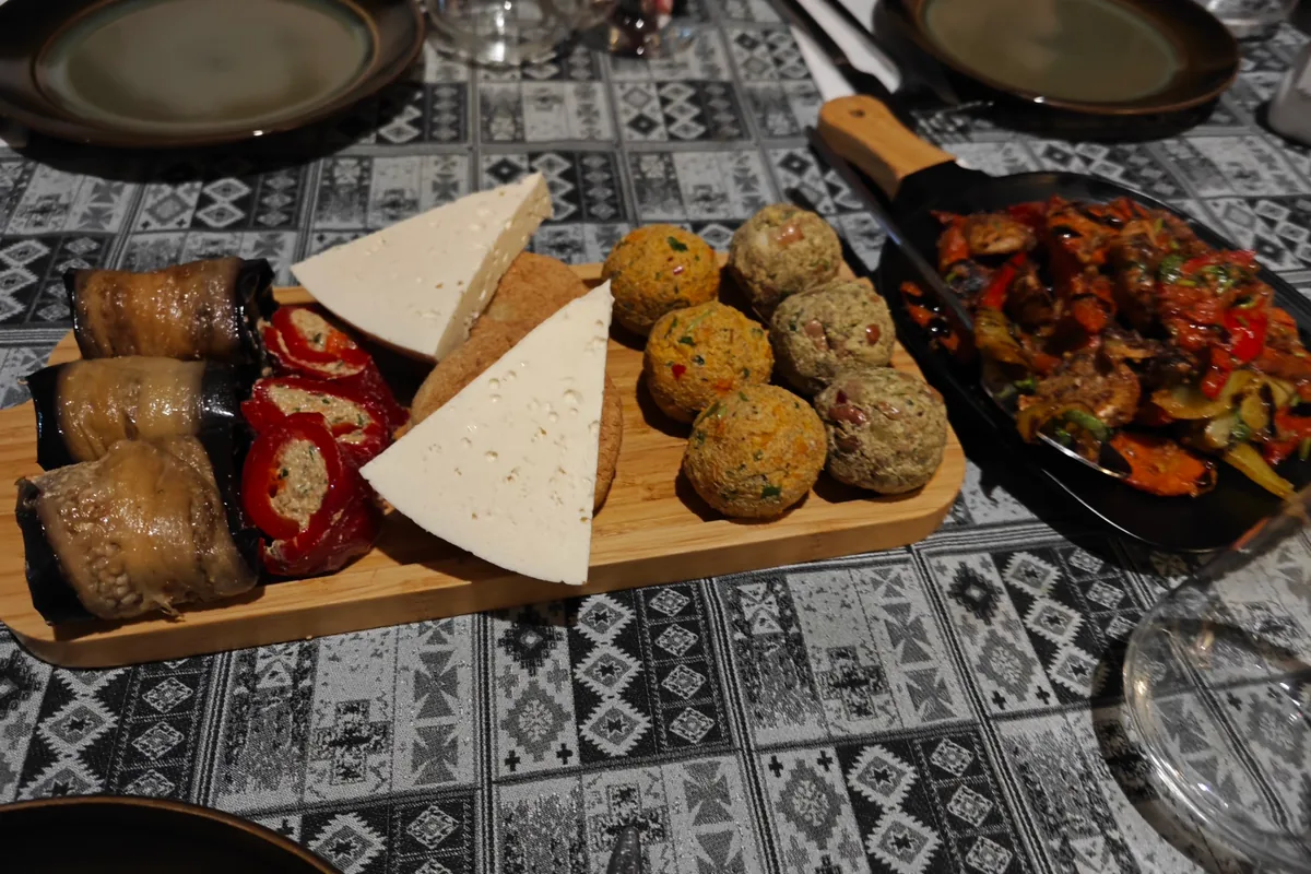 Georgian appetizer platter with pkhali, eggplant rolls, and cheese at Zazanova Salon Restaurant