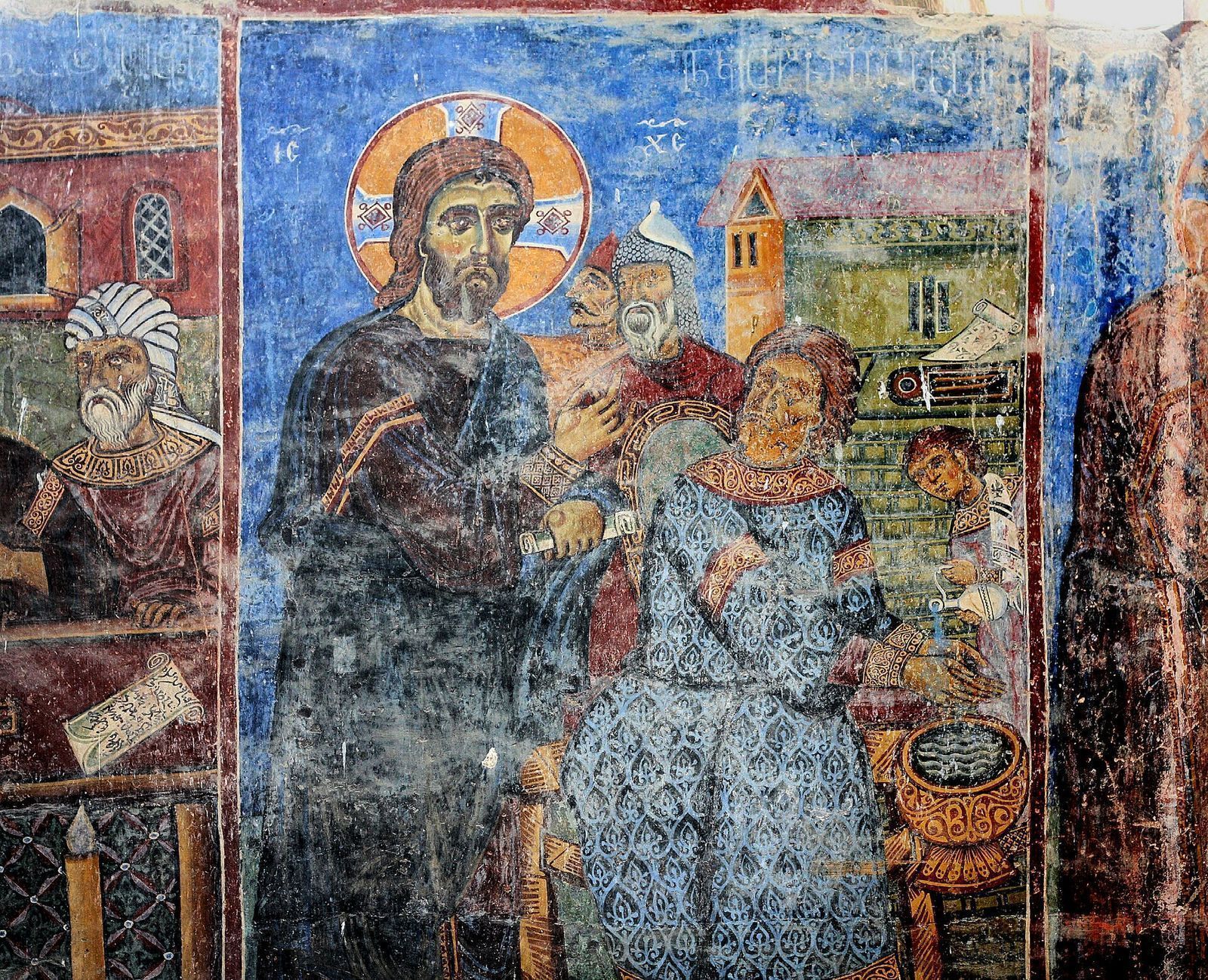 A fresco inside Akhtala Monastery showing Christ standing before Pontius Pilate in blue, red and gold