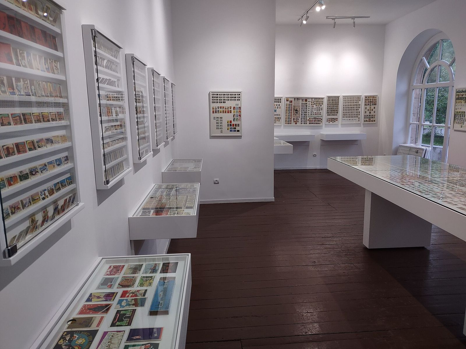 Framed matchbox labels on the walls and in glass cases inside the Matchbox Label Museum in Tumanyan