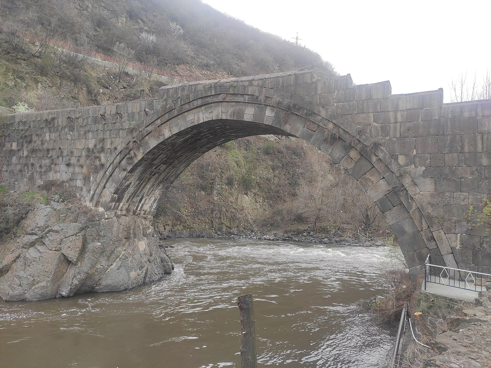 The single stone arch of the medieval Sanahin Bridge over the Debed River near Alaverdi