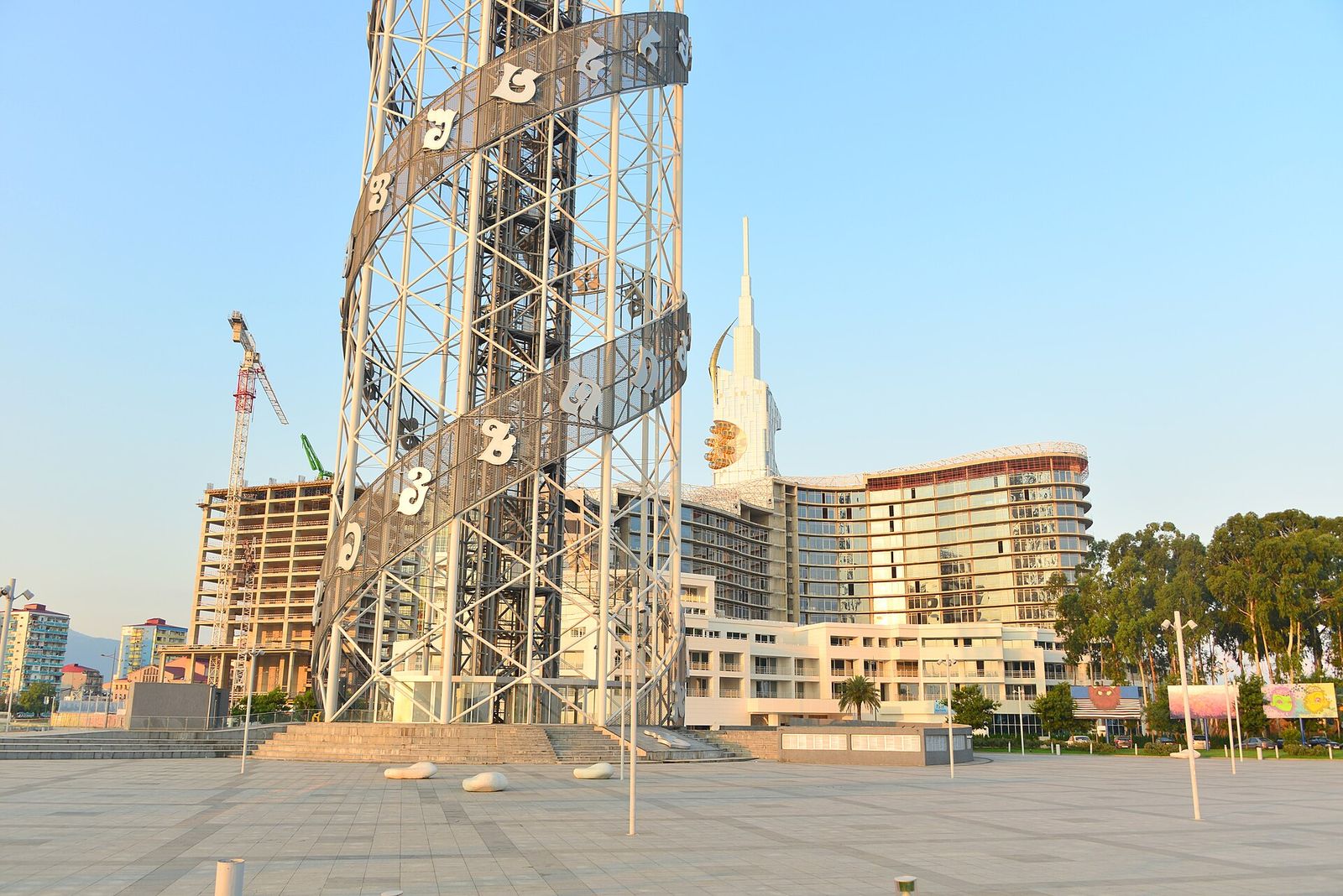 The steel lattice of Batumi's Alphabet Tower with the Georgian letters spiralling up its frame