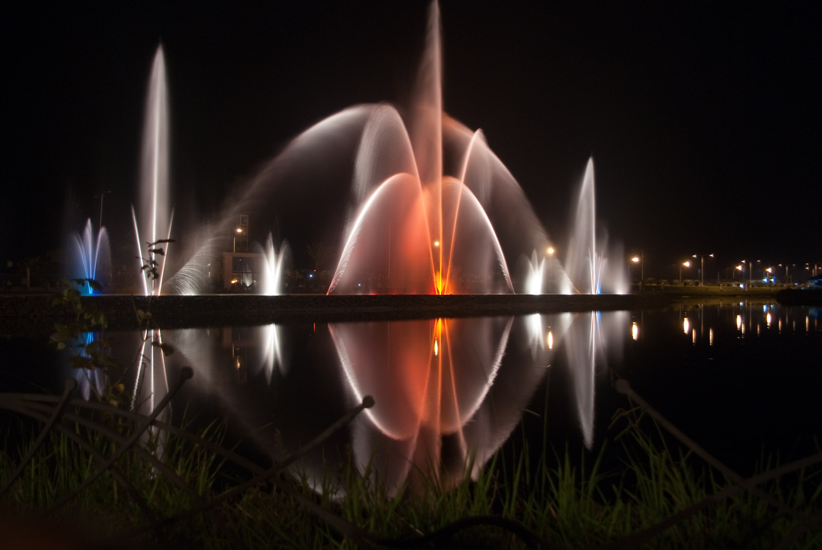 The dancing fountains lit orange and white at night over Lake Ardagani in Batumi