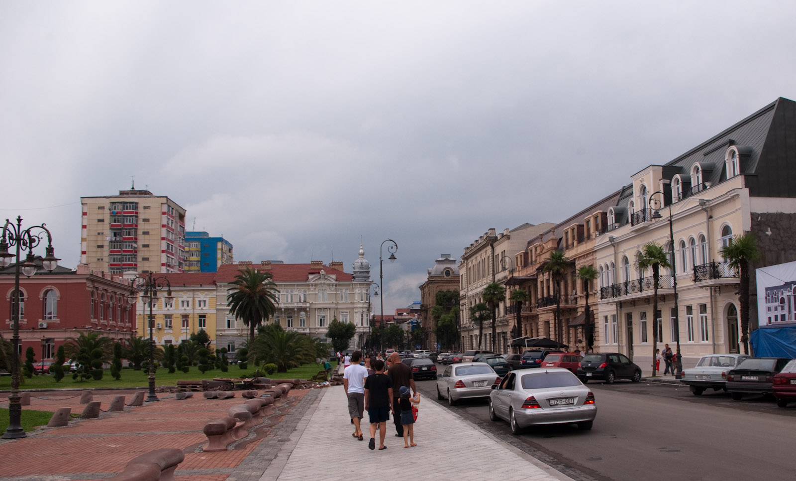A street in Old Batumi lined with restored 19th century facades, balconies and palm trees