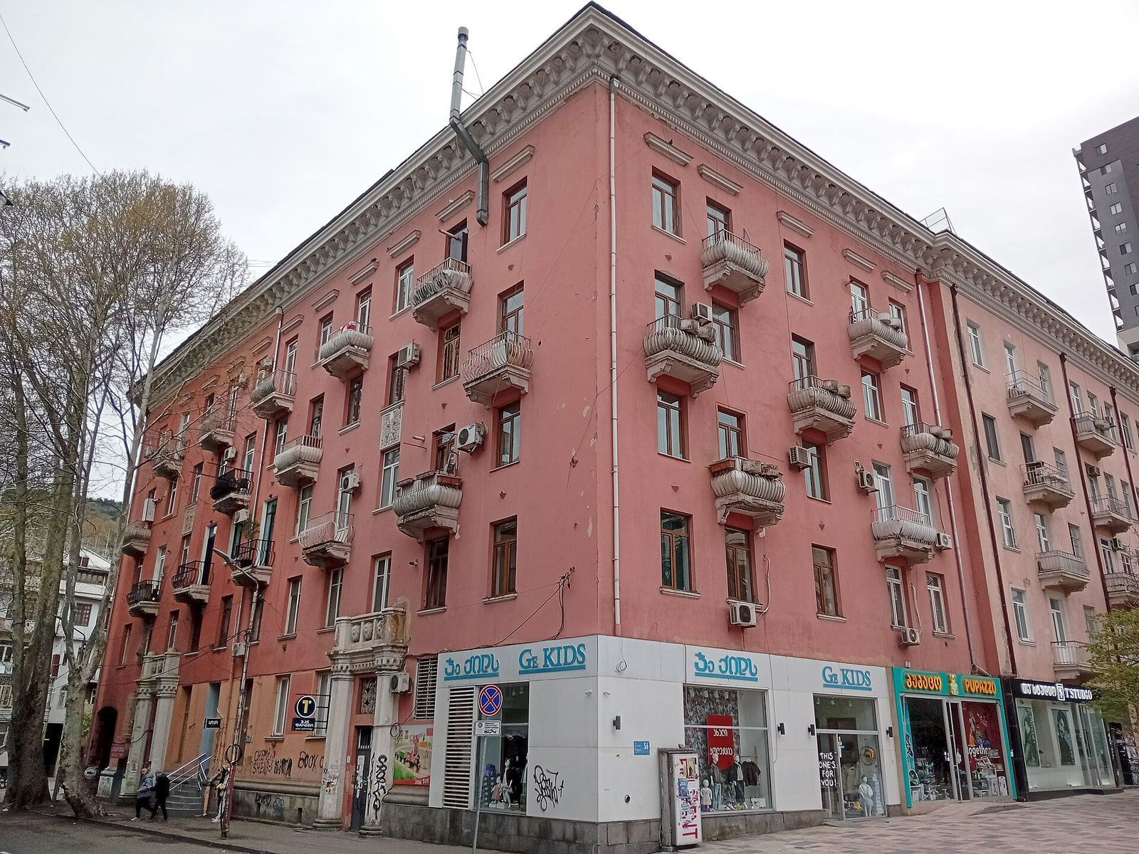A pink Stalin-era apartment block with stone balconies at 56 Ilia Chavchavadze Avenue in Vake