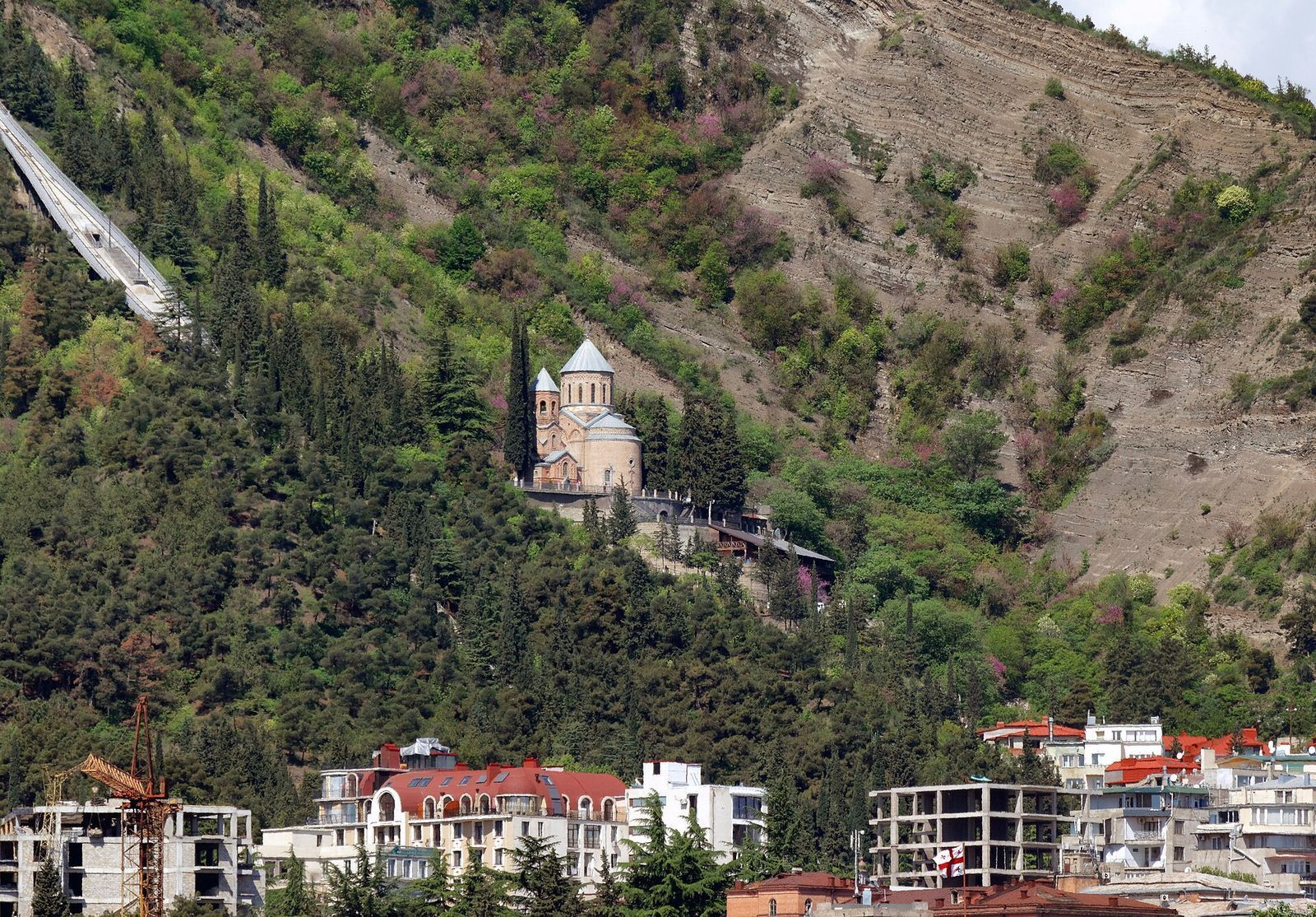 Mamadaviti Church on the wooded slope of Mtatsminda, with the funicular track climbing the hill beside it