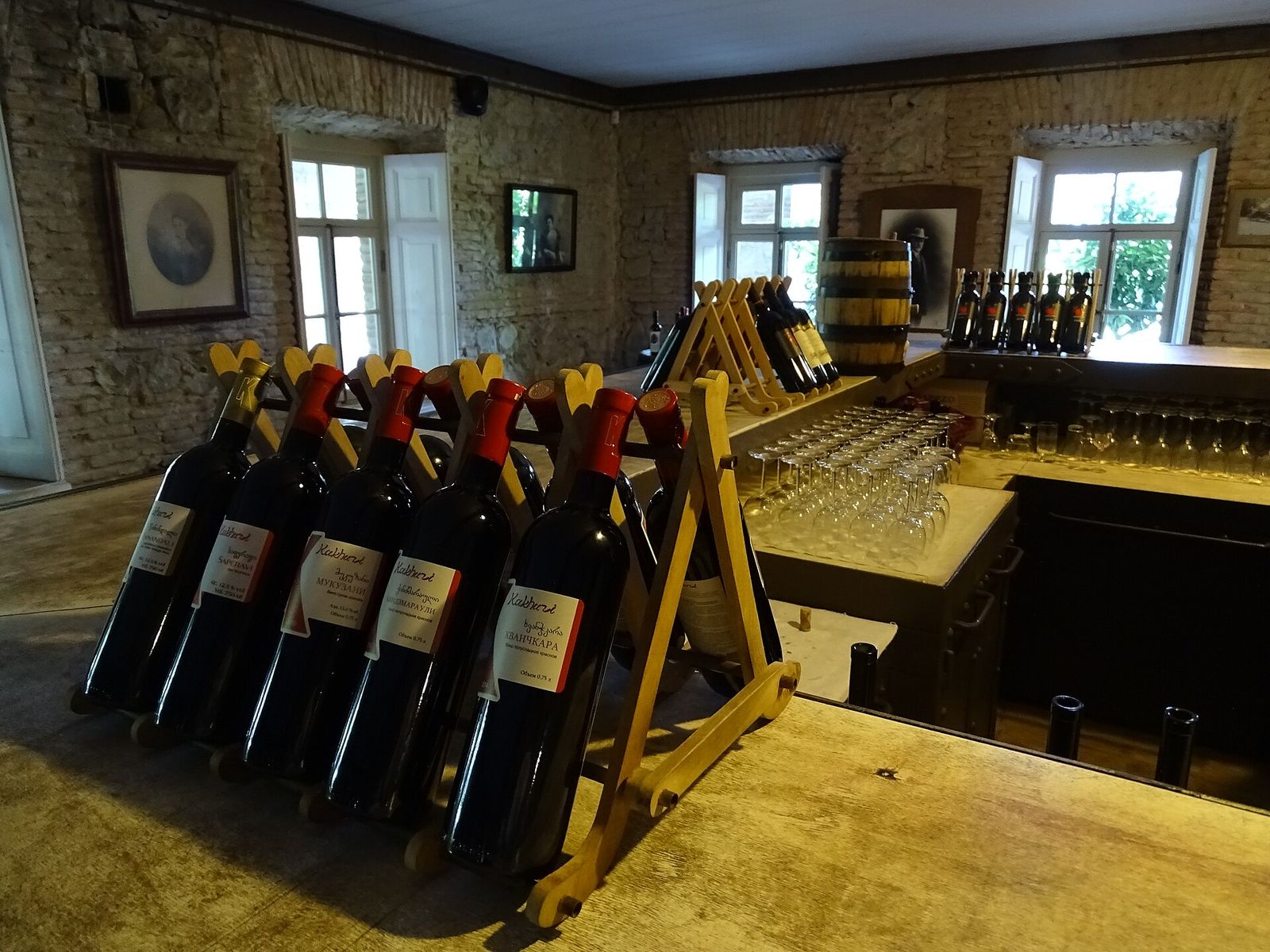 Kakhuri bottles of Saperavi, Mukuzani, Kindzmarauli and Khvanchkara on a wooden rack in the tasting room at the Chavchavadze estate in Tsinandali