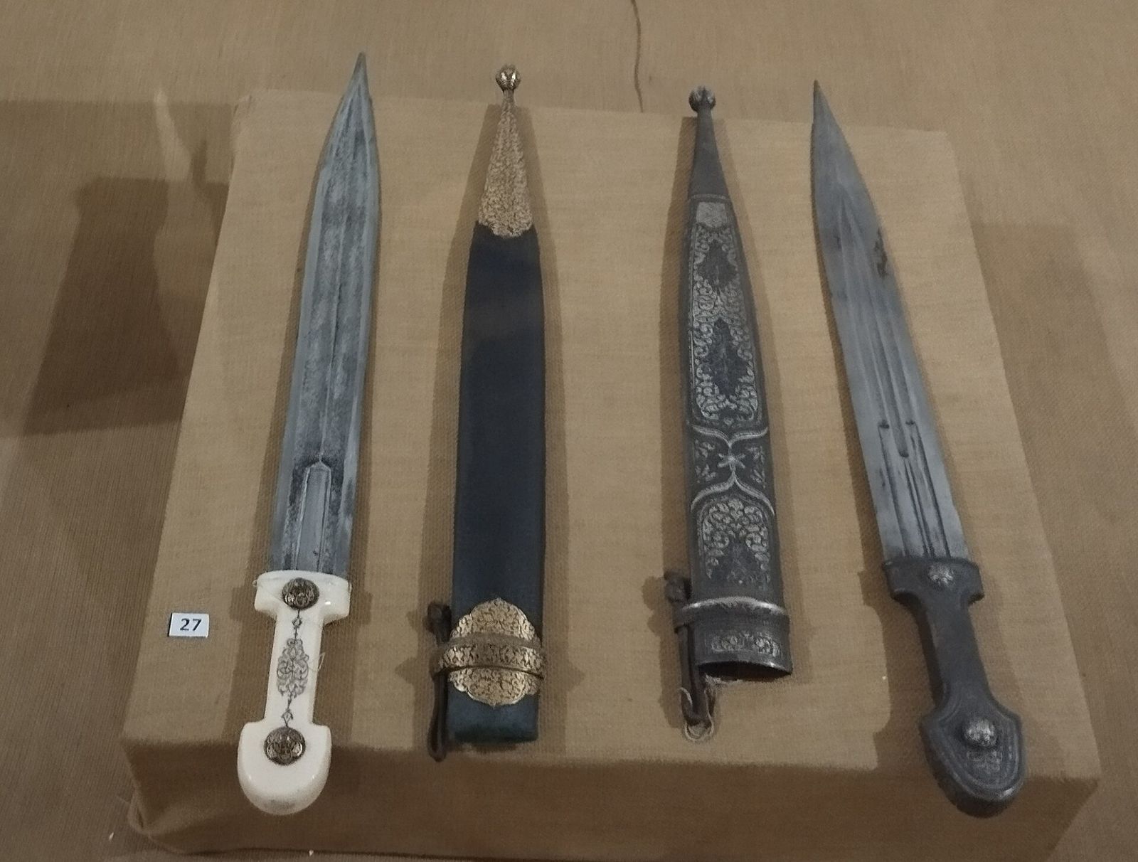 Four Georgian daggers and scabbards with silver and bone hilts on display at the Tbilisi History Museum