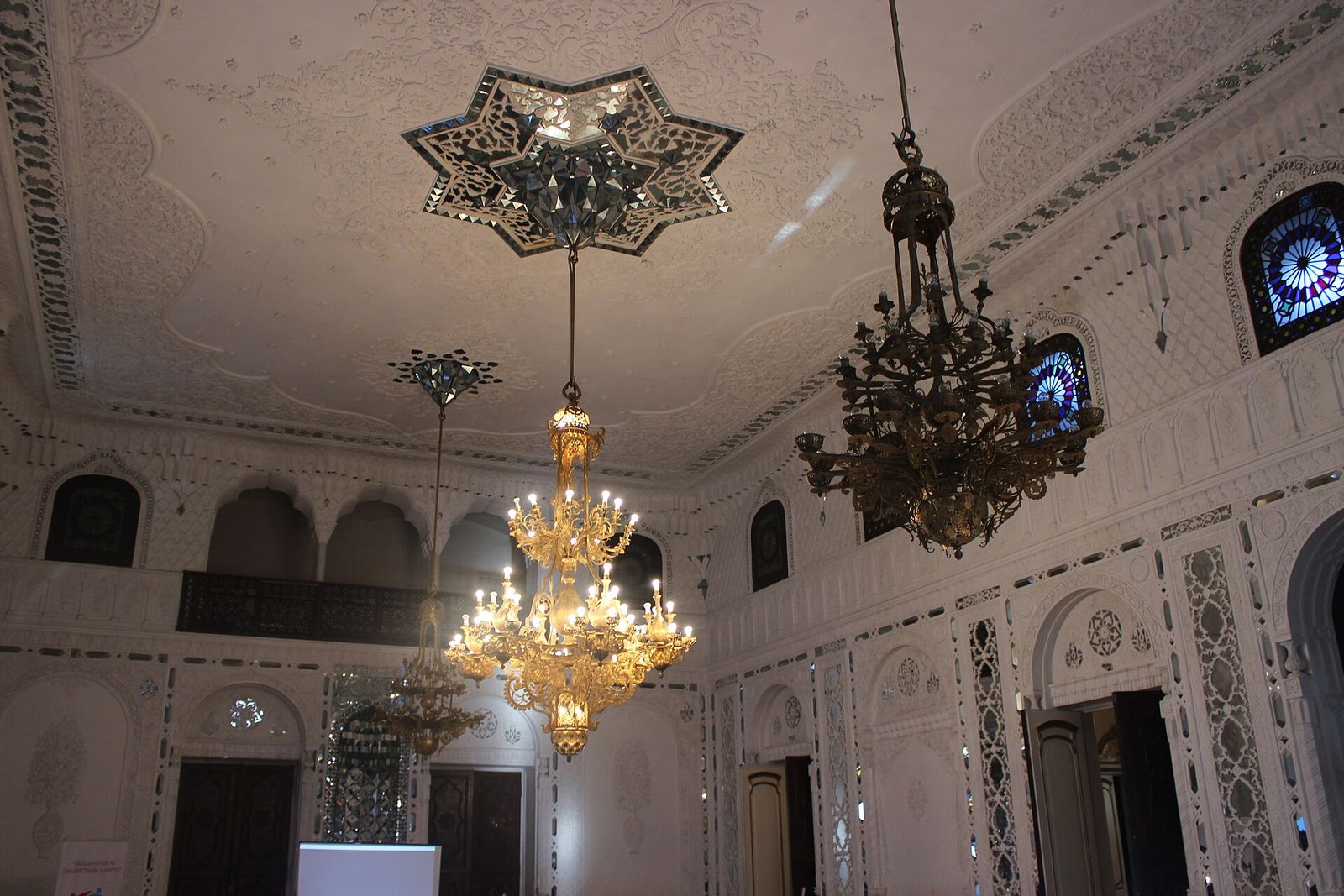 Chandeliers and mirror-inlaid walls in the Mirror Hall of the National Youth Palace on Rustaveli Avenue