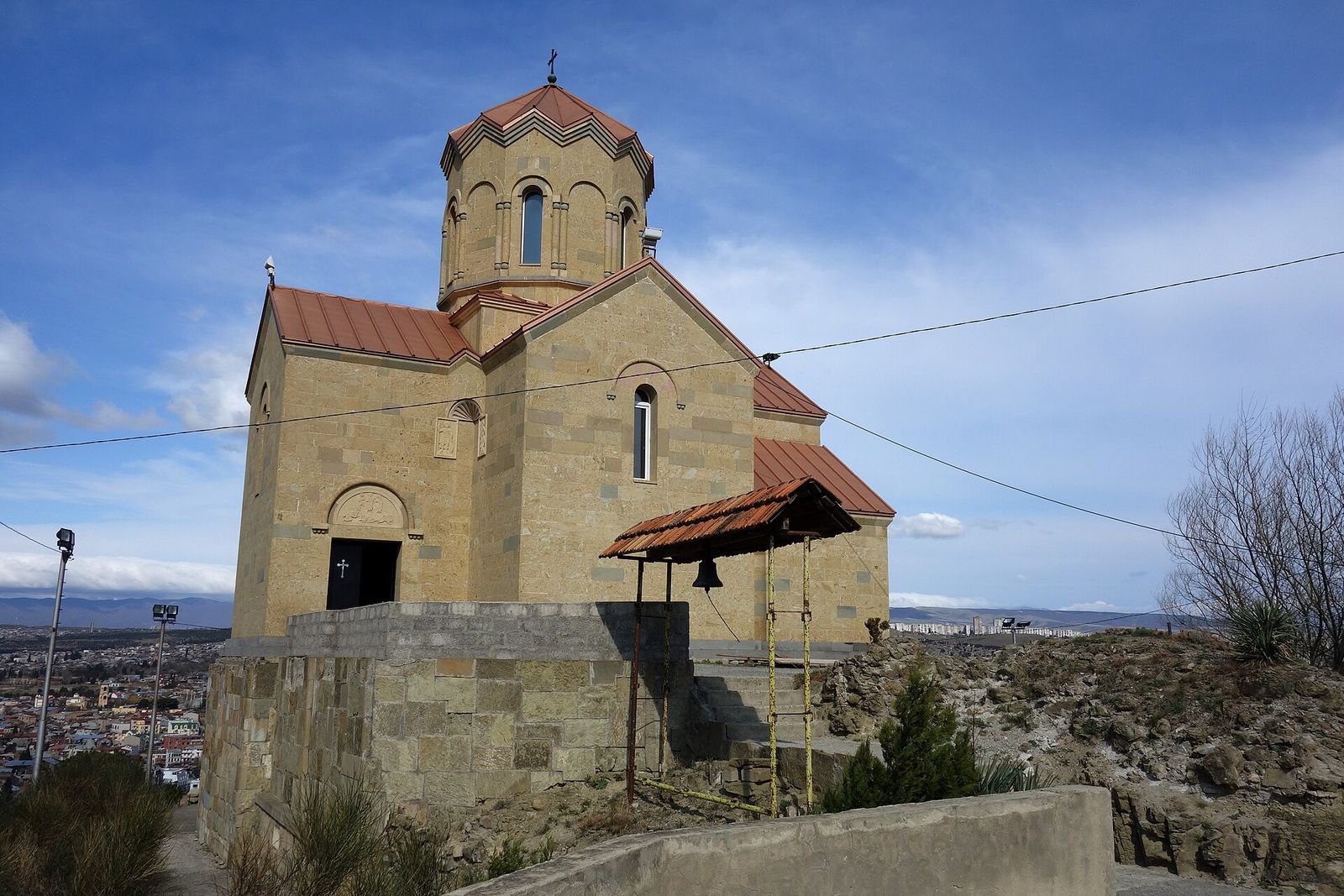 The stone church of Tabori Monastery on its hilltop above Tbilisi, with the city spreading out below