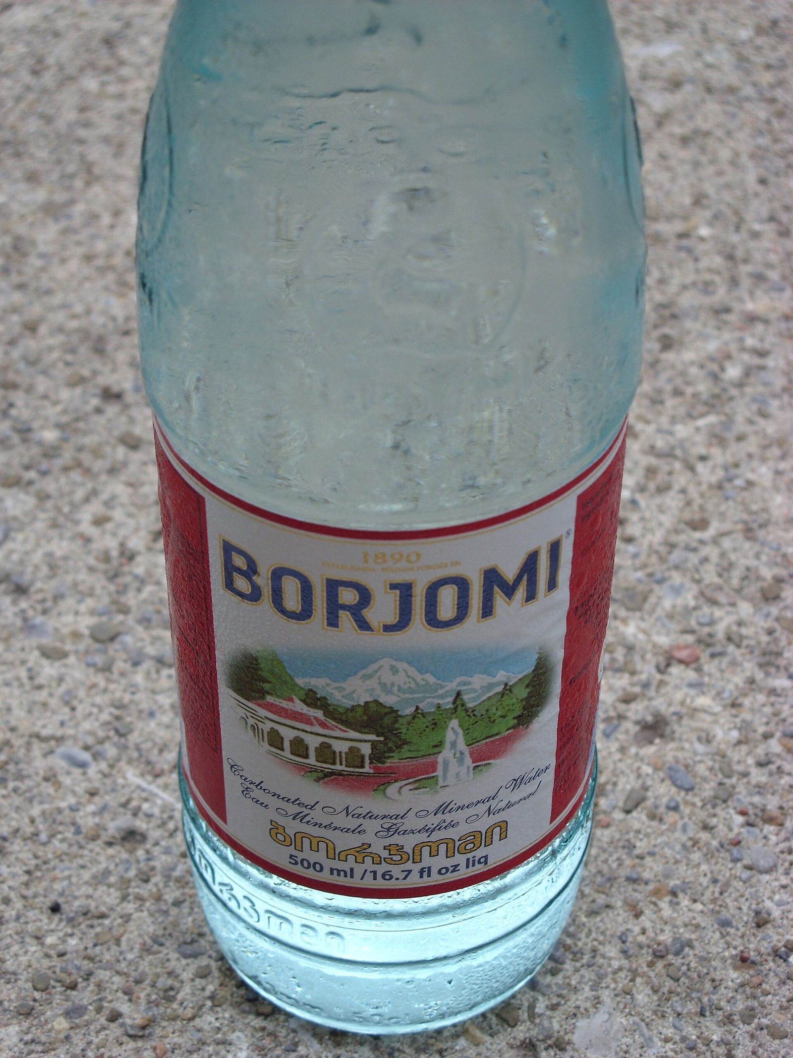 A cold bottle of Borjomi mineral water with its red label