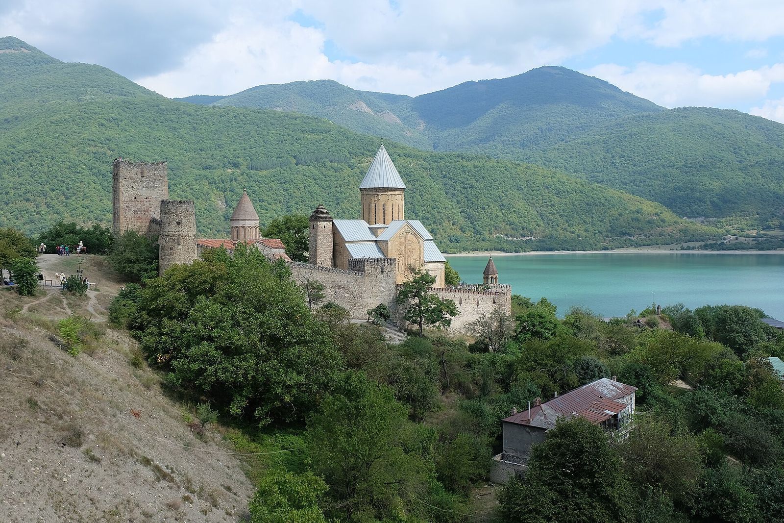 Ananuri fortress and its domed churches above the turquoise Zhinvali Reservoir on the road to Kazbegi