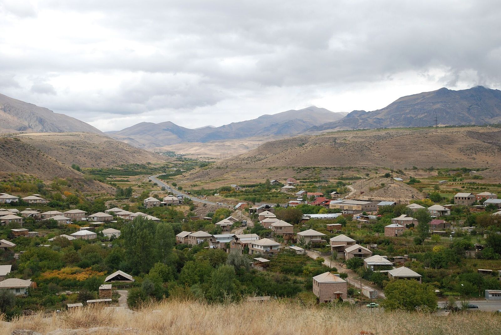 The houses and orchards of Areni village spread across the Arpa valley in southern Armenia