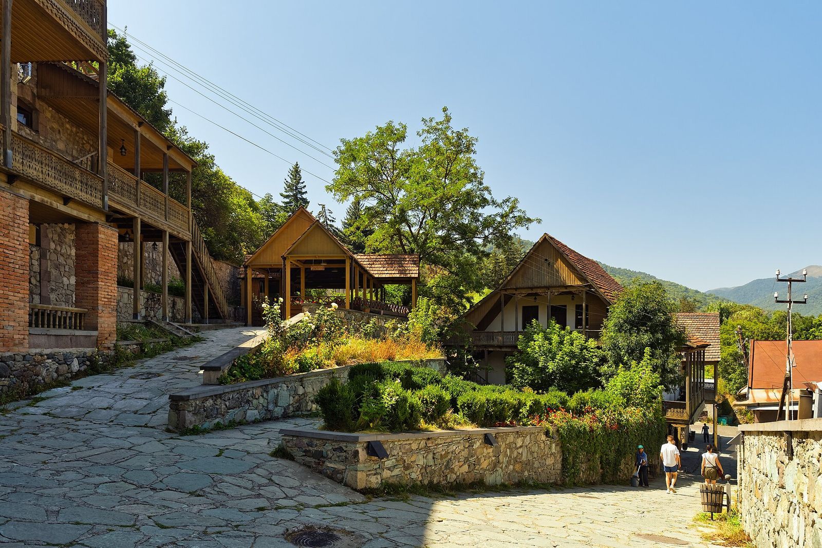 Restored stone and timber houses along cobbled Sharambeyan Street in the old town of Dilijan, Armenia