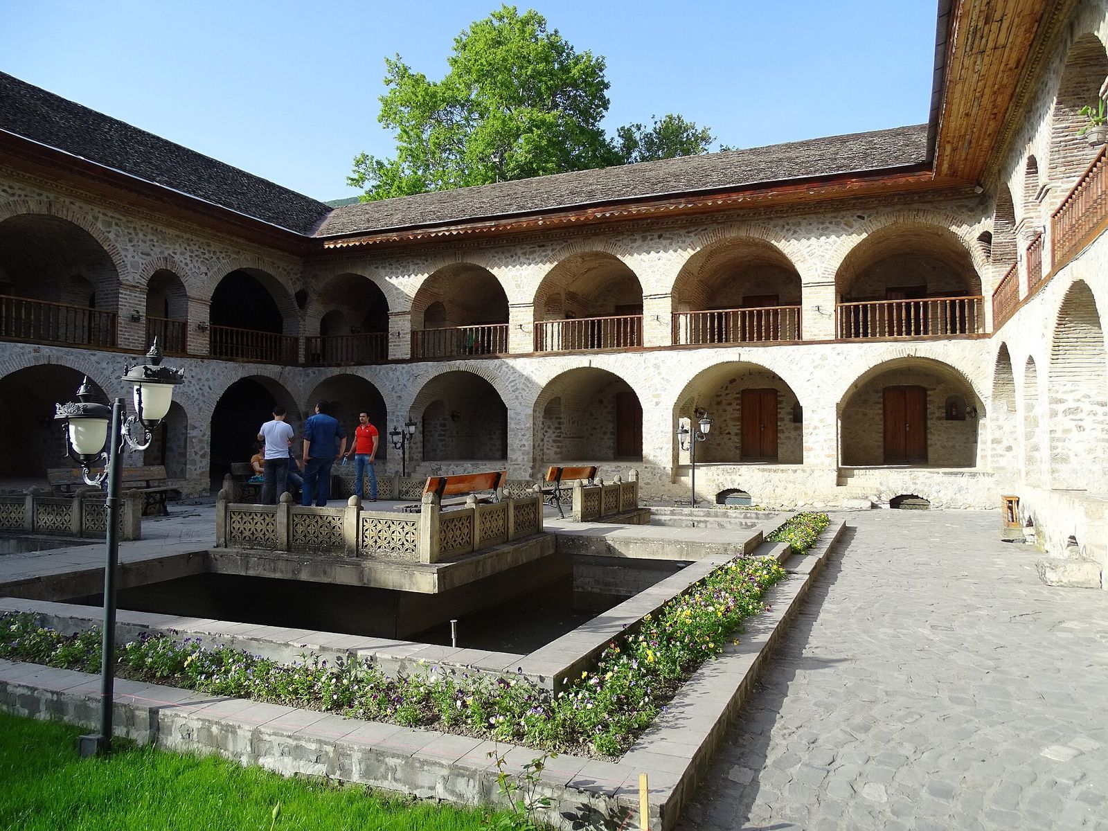 The two floors of stone arcades around the courtyard of the Upper Caravanserai in Sheki, Azerbaijan