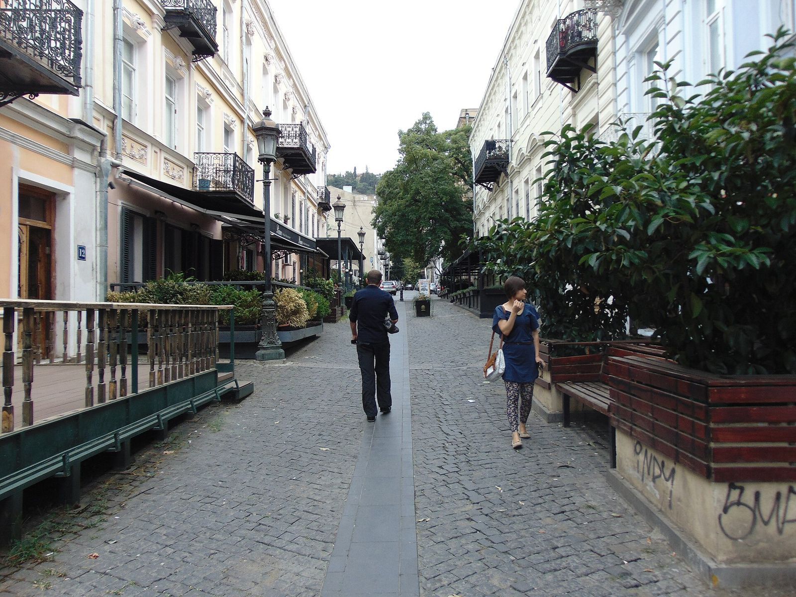 Facades with wrought-iron balconies along the cobbled pedestrian stretch of Galaktion Tabidze Street in Sololaki
